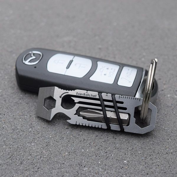 EverRatchet multi-tool with dynamic ratcheting beam, reversible functionality, and Flint2Go fire flint, designed for everyday carry (EDC) and outdoor use.