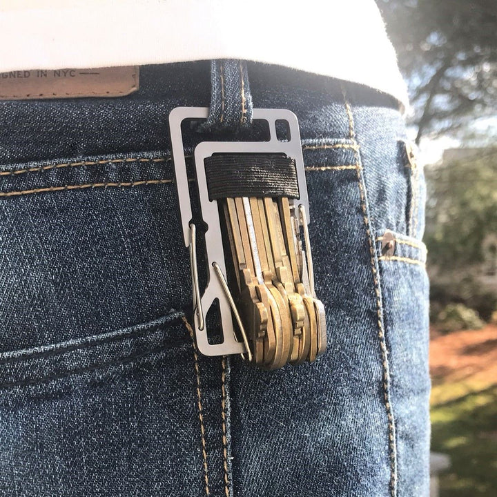 KT10 Key Titan carabiner made from grade 5 titanium, featuring a key organizer for up to 10 keys, built-in bottle opener, and 1/4-inch slip wrench for EDC use.