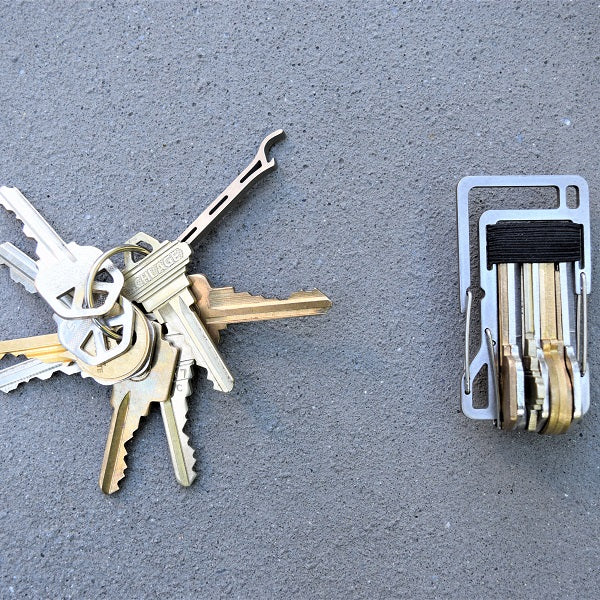 KT10 Key Titan carabiner made from grade 5 titanium, featuring a key organizer for up to 10 keys, built-in bottle opener, and 1/4-inch slip wrench for EDC use.